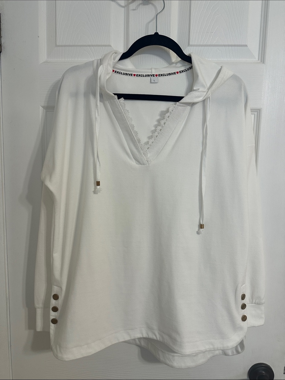 White Hoodie with Lace V-Neck. Embellished with Gold non working Buttons.